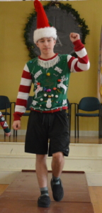 Second prize winner Kyle shows off his ugly holiday sweater!