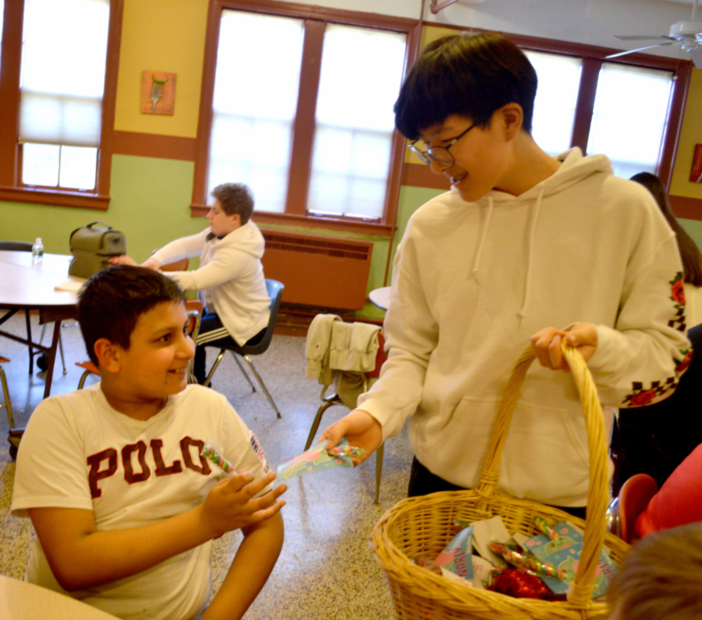 Student Advisory Board member WIlliam delivers a Valentine's Day Candy Gram to Middle Schooler Rohaan!