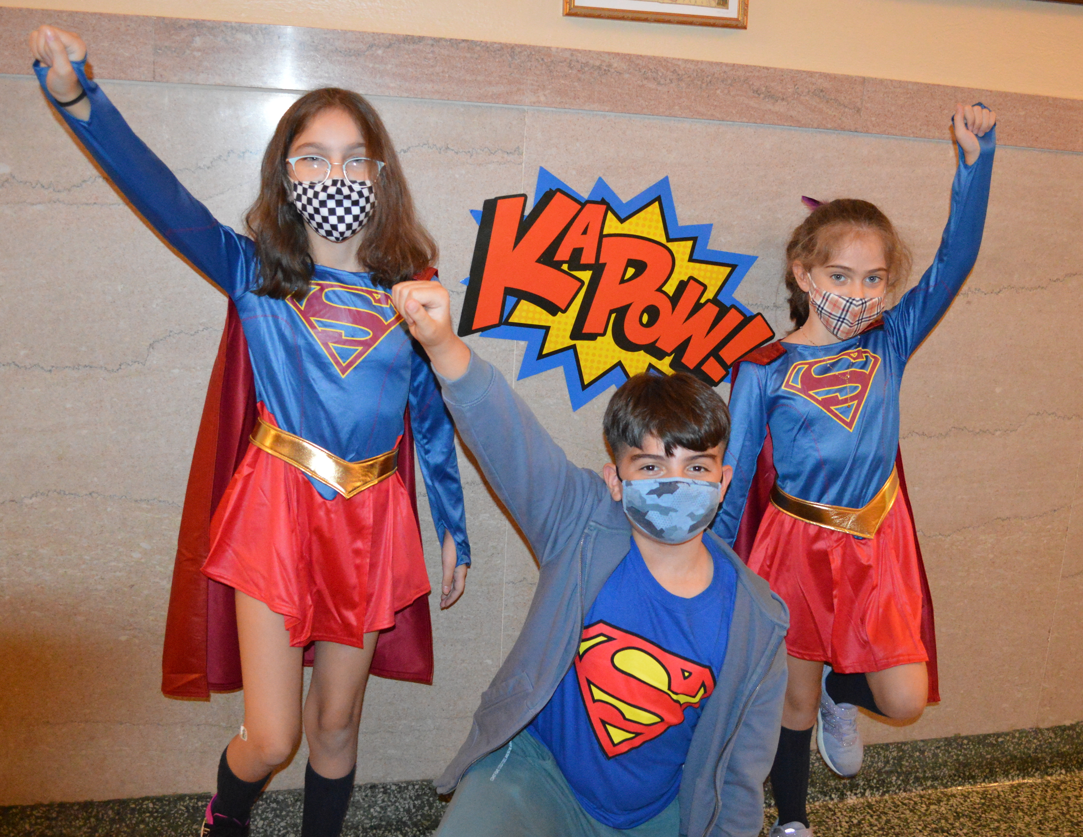 Lower Schoolers Annamaria, Martin and Vanessa strike a superhero pose!